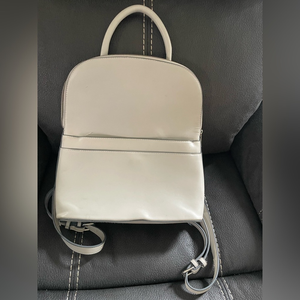 Leather-like cream Backpack/purse.  Very good condition. Used only a few times